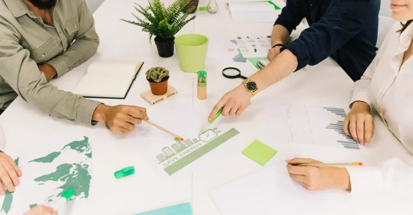 group-businesspeople-making-plans-energy-saving-workplace