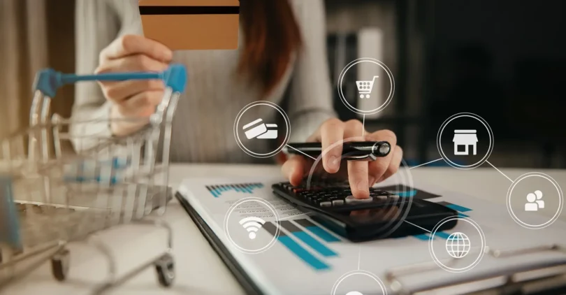 hands-holding-credit-card-using-calculator-online-shopping